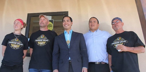 HUD Secretary Julián Castro (center) stands with the development team after touring the NASHI and Thunder Valley CDC straw-bale house. L to R: NASHI Research Assistant Janna Ferguson, NASHI Executive Director Rob Pyatt, Secretary Castro, Thunder Valley CDC Executive Director Nick Tilsen, and Oglala Lakota College Professor Lennie Lone Hill. Photo appears courtesy of NASHI.