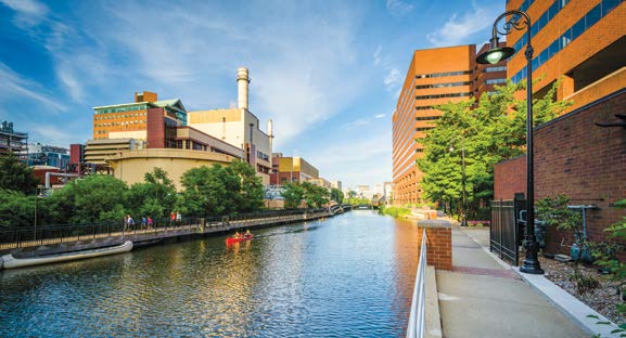 Photo of a man-made canal flanked by high-rise buildings in urban Cambridge, Massachusetts.  