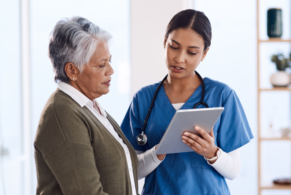  A doctor consulting with a senior woman.